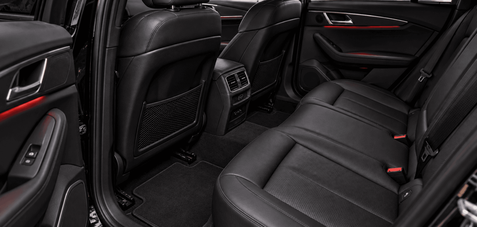 The same rear seats and floor mats after detailing, clean throughout
